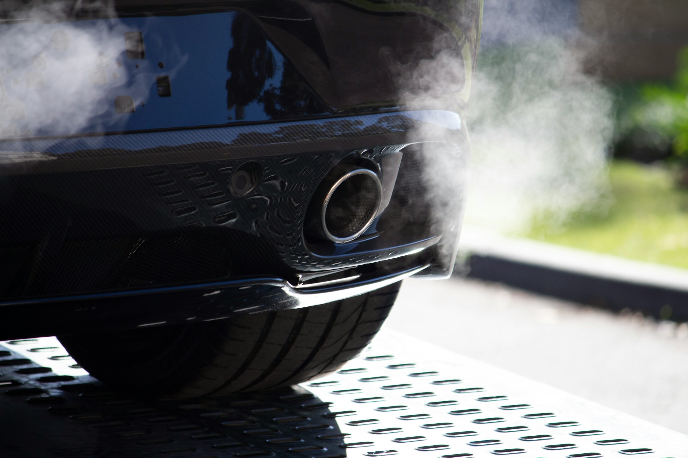 Close view of exhaust coming from a car's tailpipe
