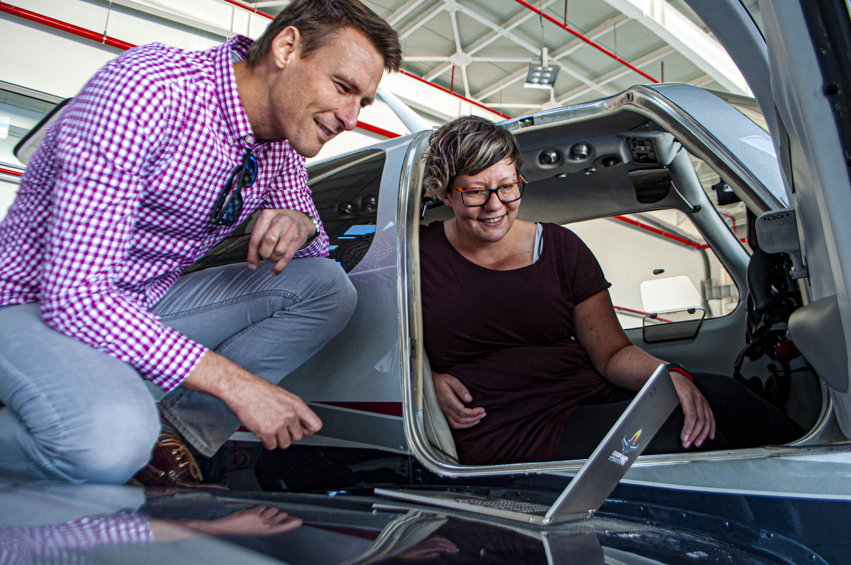 Researchers looking at a laptop together.
