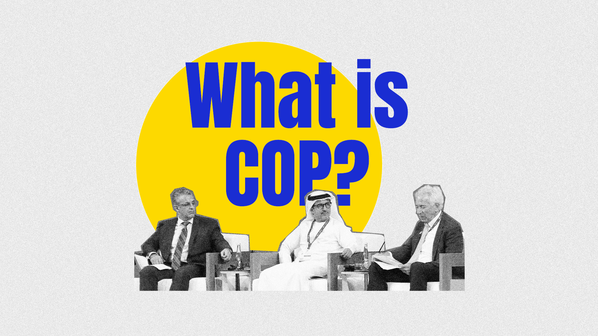The words 'What is COP' displayed over speakers seated at a confernece.