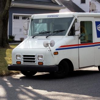 A postal delivery truck but not one of the cool new electric ones