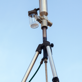 A low-angle shot of an air quality monitor