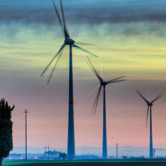 Wind turbines under the glow of the northern lights