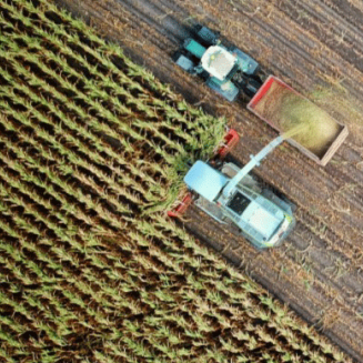 View from above of trucks on farmland
