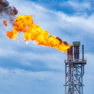 Fire on flare stack at oil and gas central processing platform while burning toxic and release over pressure from process.