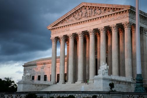 U.S. Supreme Court under a cloudy sky