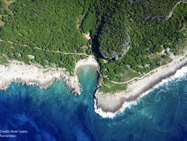 aerial shot of an island surrounded by ocean