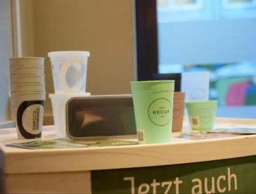 Reusable cups in a bright room.