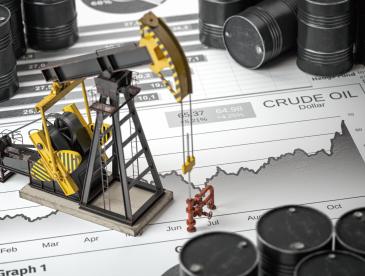 Miniature oil pumpjack and drilling equipment positioned on top of a crude oil price chart, surrounded by black oil barrels. The chart, labeled “CRUDE OIL Dollar,” shows a rising trend over several months, symbolizing oil production, commodity markets, and fluctuations in energy prices.
