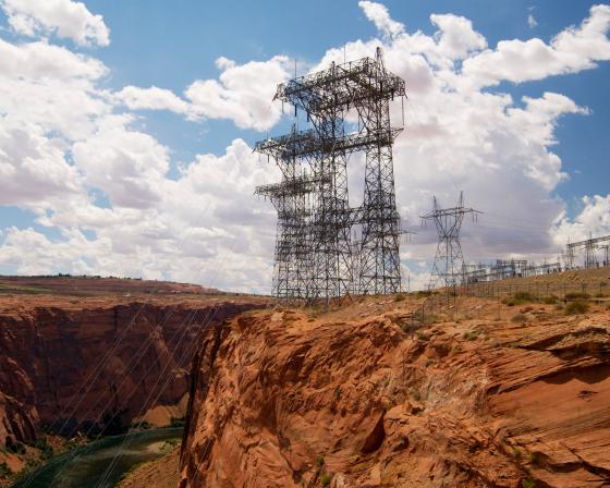 Electrical towers on rocky outcroppings.