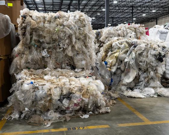 Overflowing pallets of plastic waste.